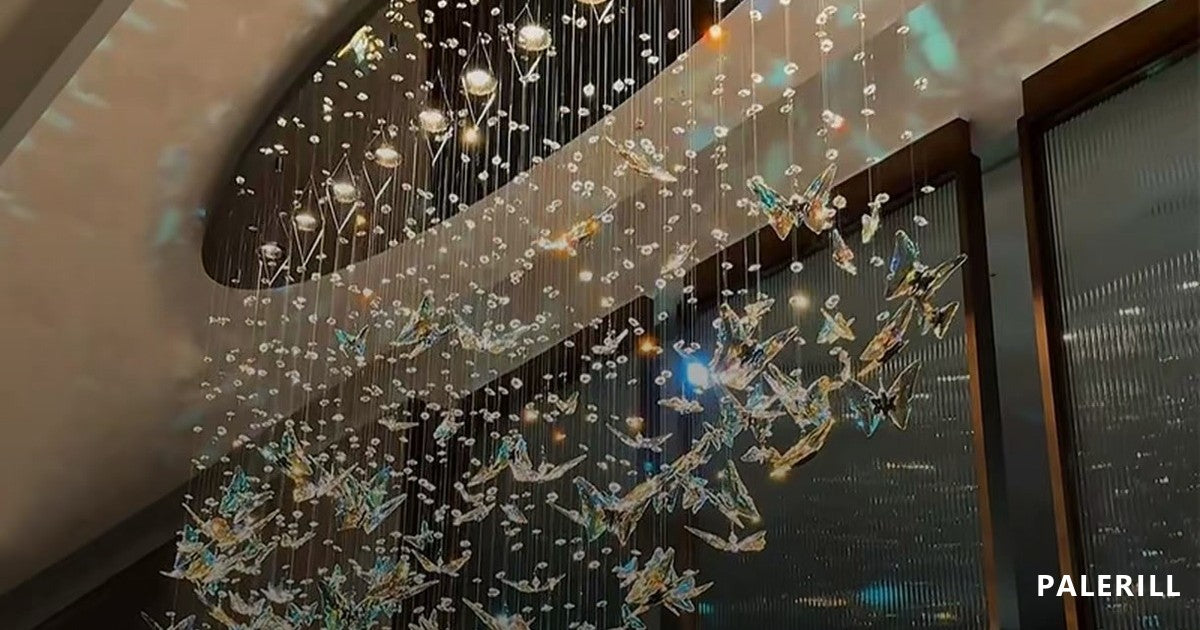 Cascading crystal chandelier suspended in a double-height stairwell