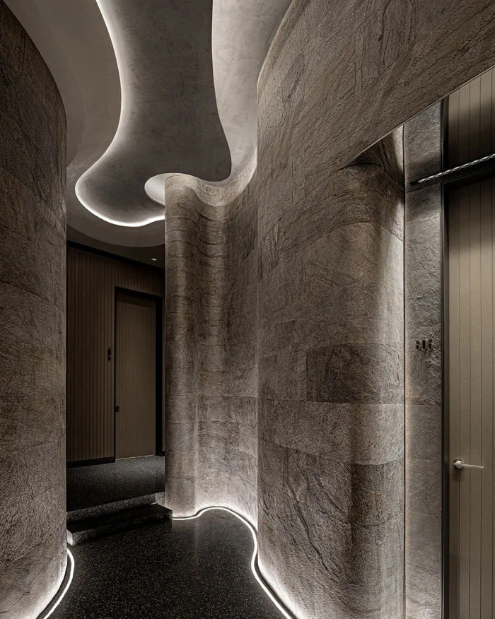 Fine-dining room with sculpted linear ceiling lighting