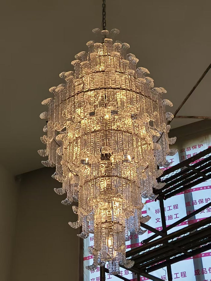 Tiered crystal cascade chandelier installed in a double-height private residence