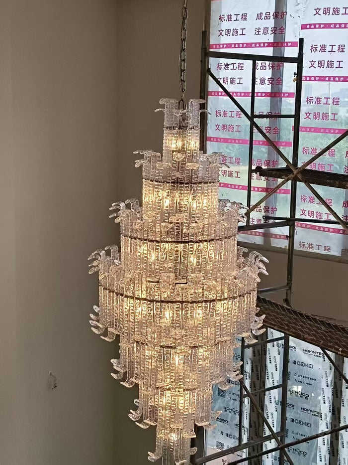 Tiered crystal cascade chandelier installed in a double-height private residence
