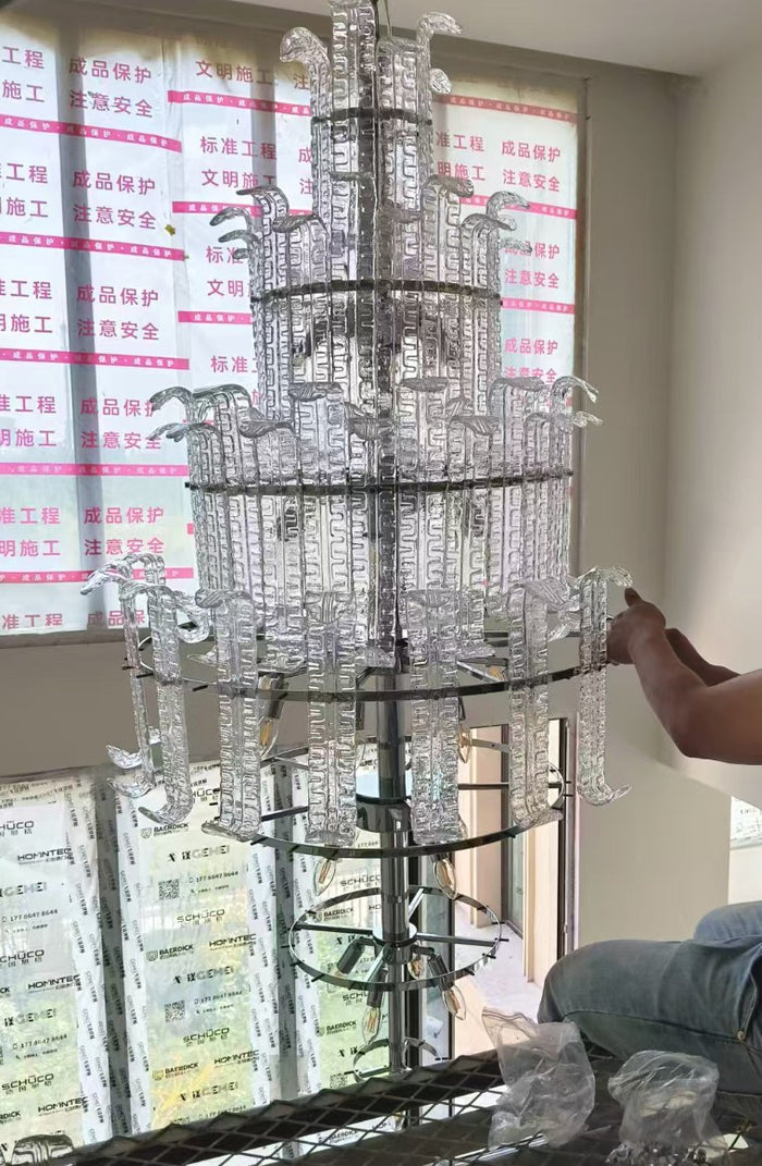 Tiered crystal cascade chandelier installed in a double-height private residence