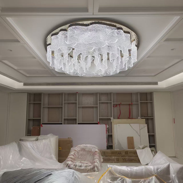 Flush ovoid crystal ceiling chandelier installed in a coffered ceiling