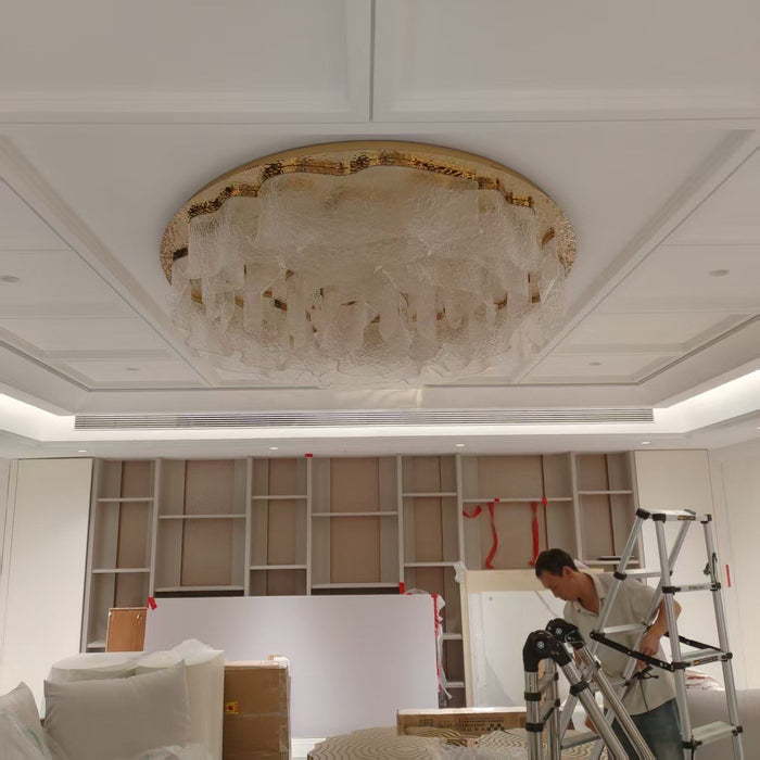 Flush ovoid crystal ceiling chandelier installed in a coffered ceiling