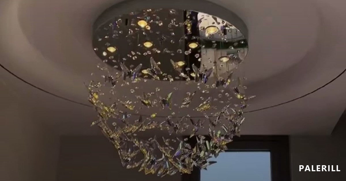 Crystal chandelier set against a dark ceiling