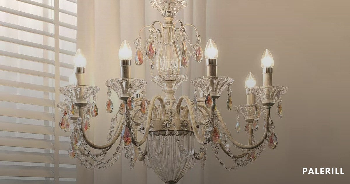 Crystal chandelier with candle arms, lit from within