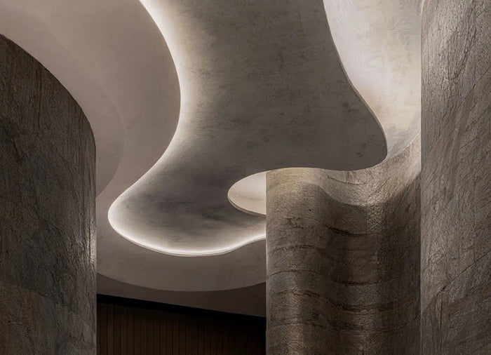 Fine-dining room with sculpted linear ceiling lighting