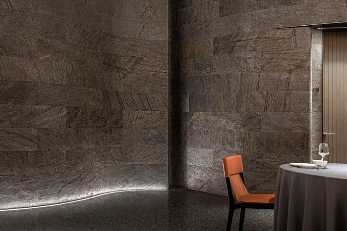 Fine-dining room with sculpted linear ceiling lighting
