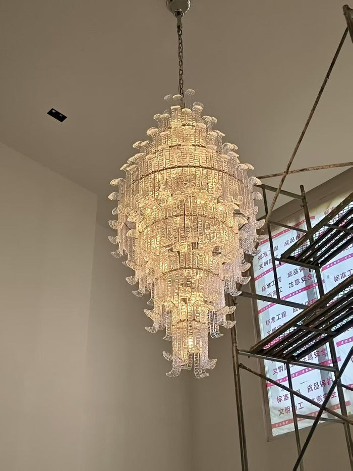 Tiered crystal cascade chandelier installed in a double-height private residence