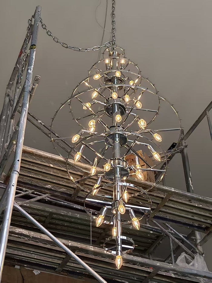 Tiered crystal cascade chandelier installed in a double-height private residence