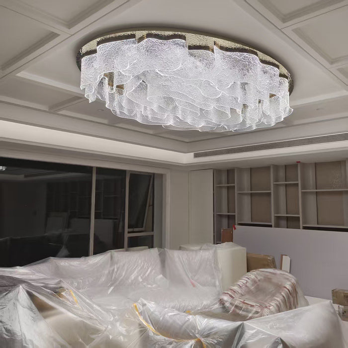 Flush ovoid crystal ceiling chandelier installed in a coffered ceiling