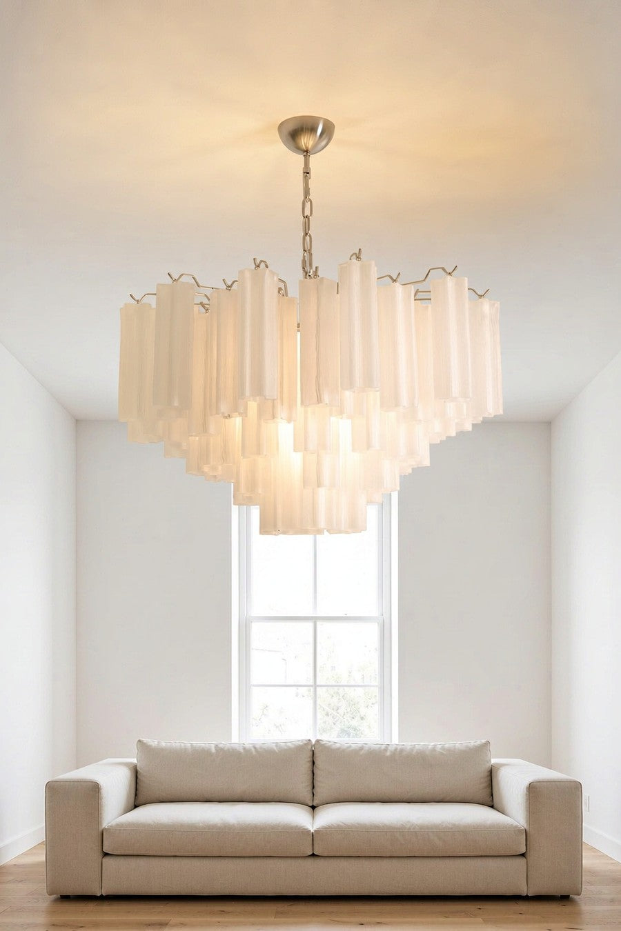 White frosted glass cylinder chandelier in a bright modern minimalist living room